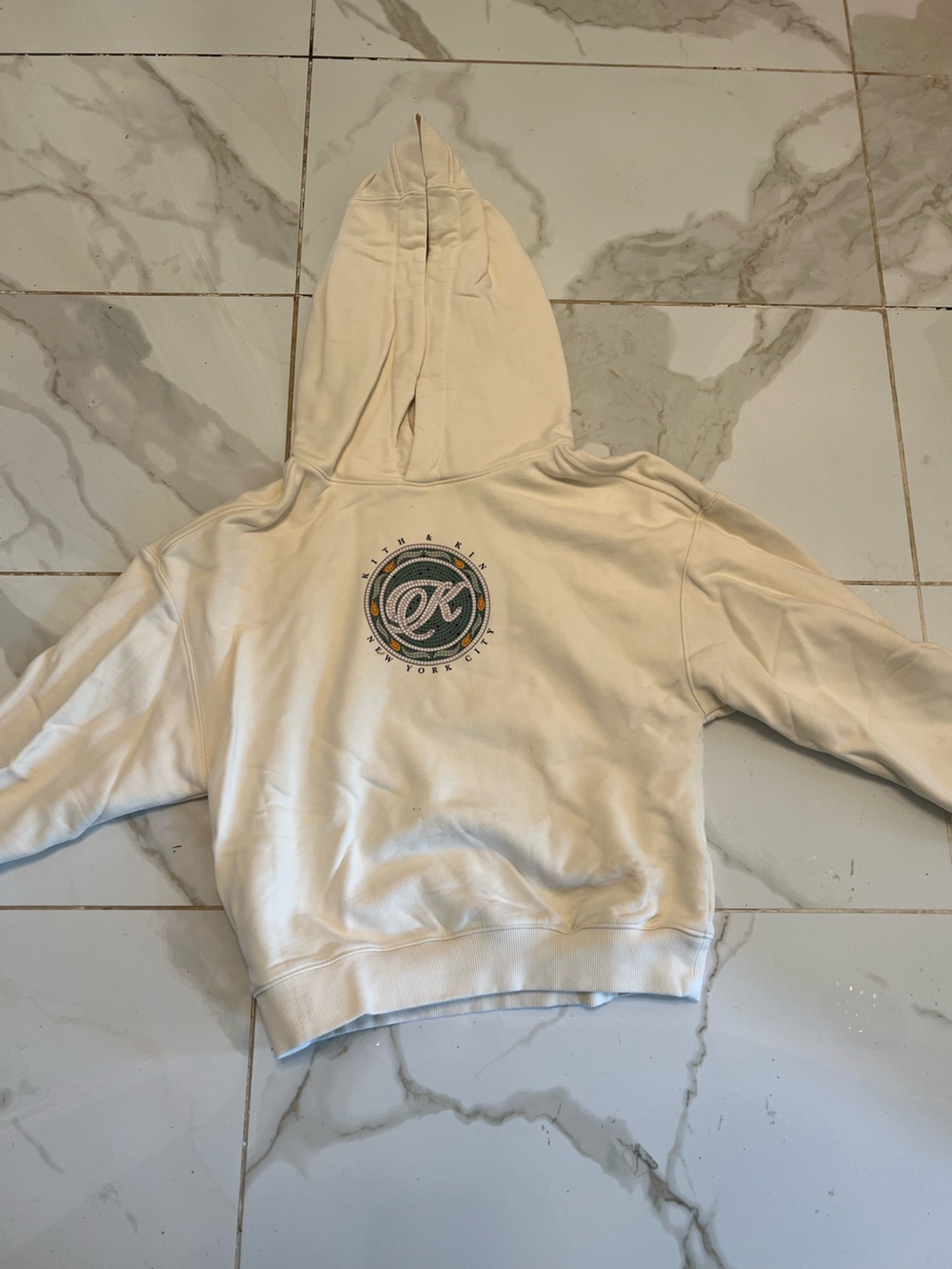 Kith Cream Hoodie with Green and Orange Circular Logo